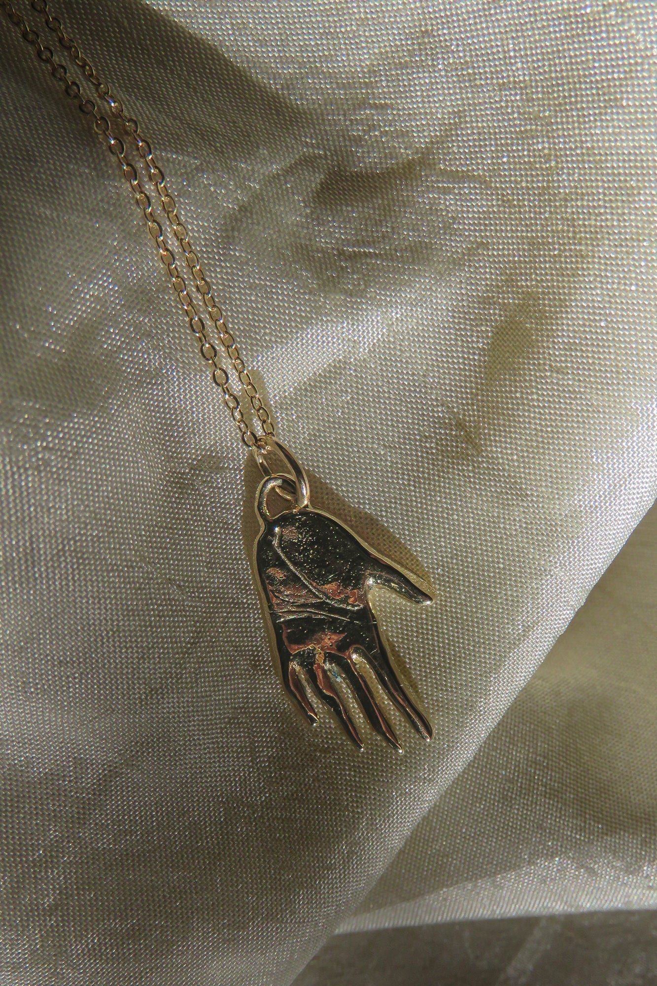 Gold Hand Talisman Necklace